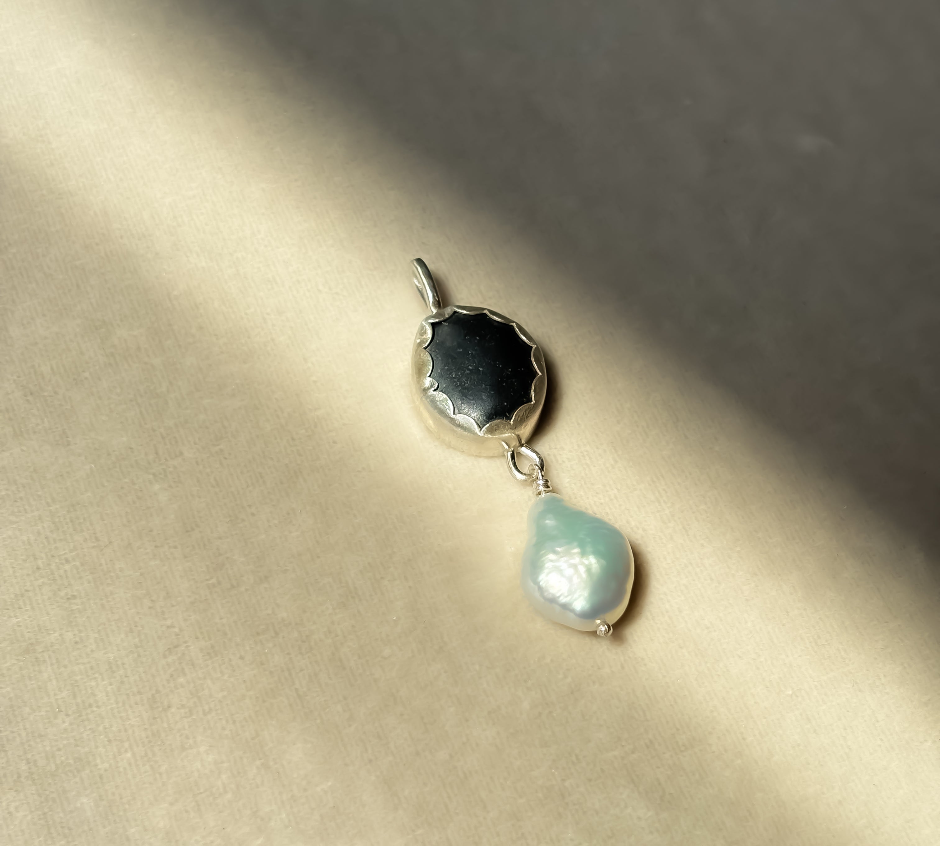 Remnant 014 - Black Pebble with Freshwater Keshi Pearl Silver Pendant