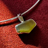 Remnant 002 - Silver Mustard Yellow Seaglass Red Garnet Pendant