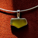 Remnant 002 - Silver Mustard Yellow Seaglass Red Garnet Pendant