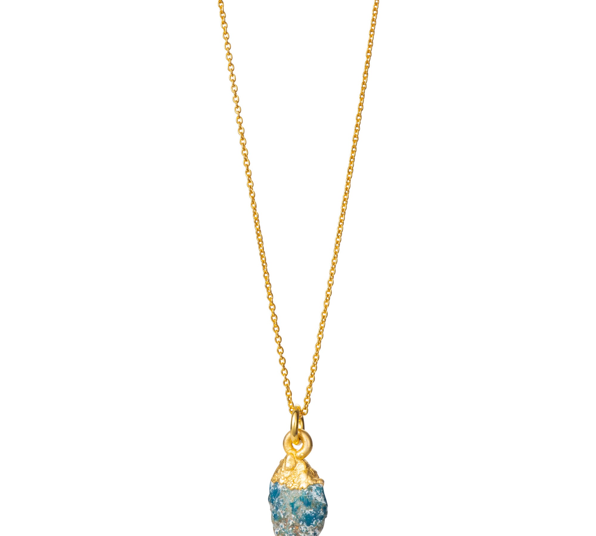 A raw Turquoise crystal pendant electroplated in gold, hanging from a gold-filled cable chain necklace.